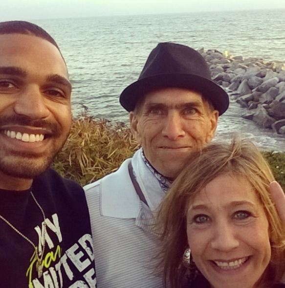 In 2014, Tyler Lepley was photographed with his stepfather and mother, Charles Jen Dinnis (photo courtesy of Charles Jen Dinnis' Instagram).