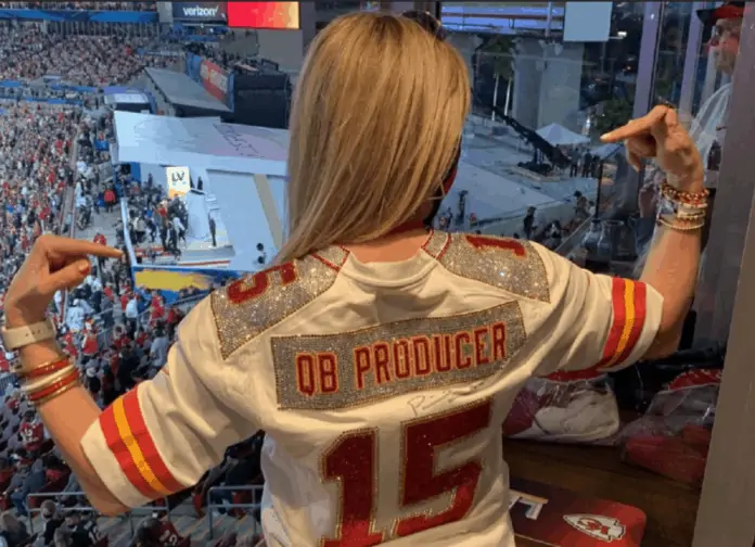Randi Mahomes shows off her tremendous jacket at Super Bowl with her son’s jersey number 15 on it.